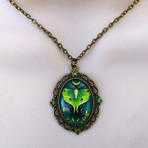 Luna moth glass dome antiqued gold in a lacey surround pendant necklace